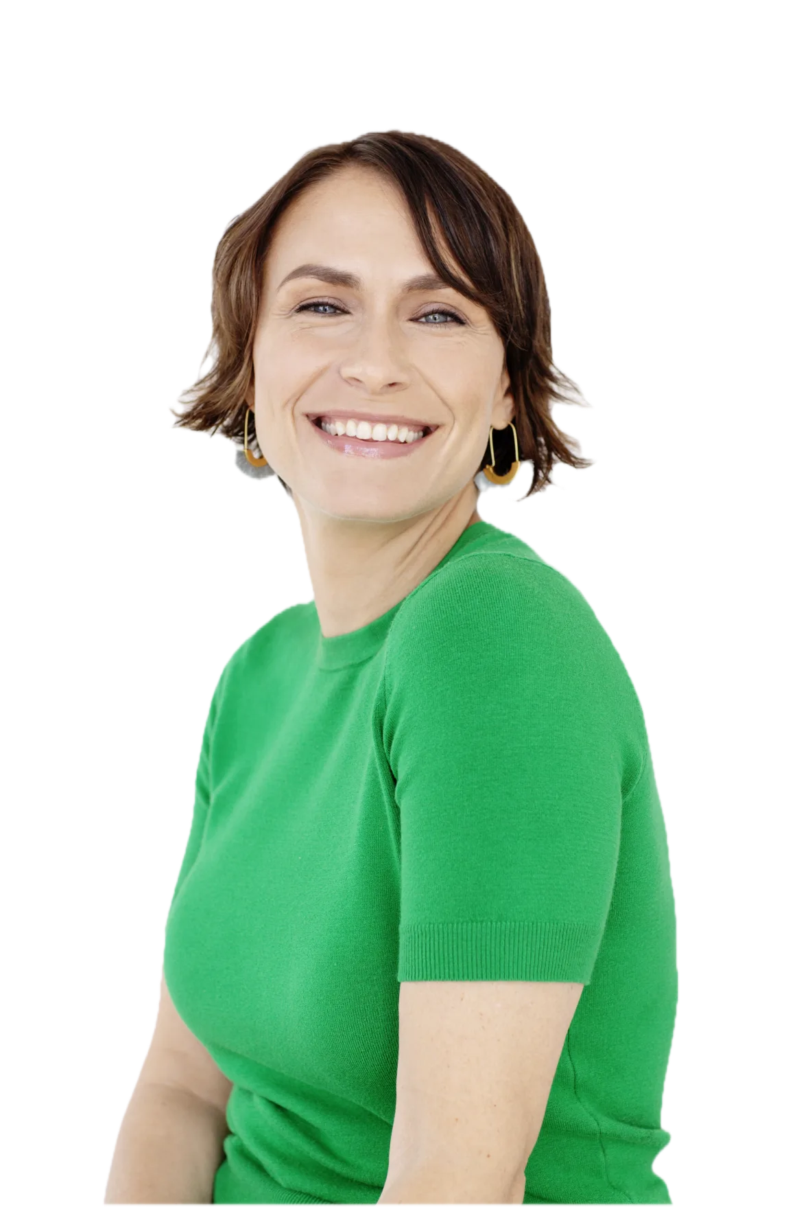 Image-7.png Person smiling, wearing a green shirt and hoop earrings against a white background.